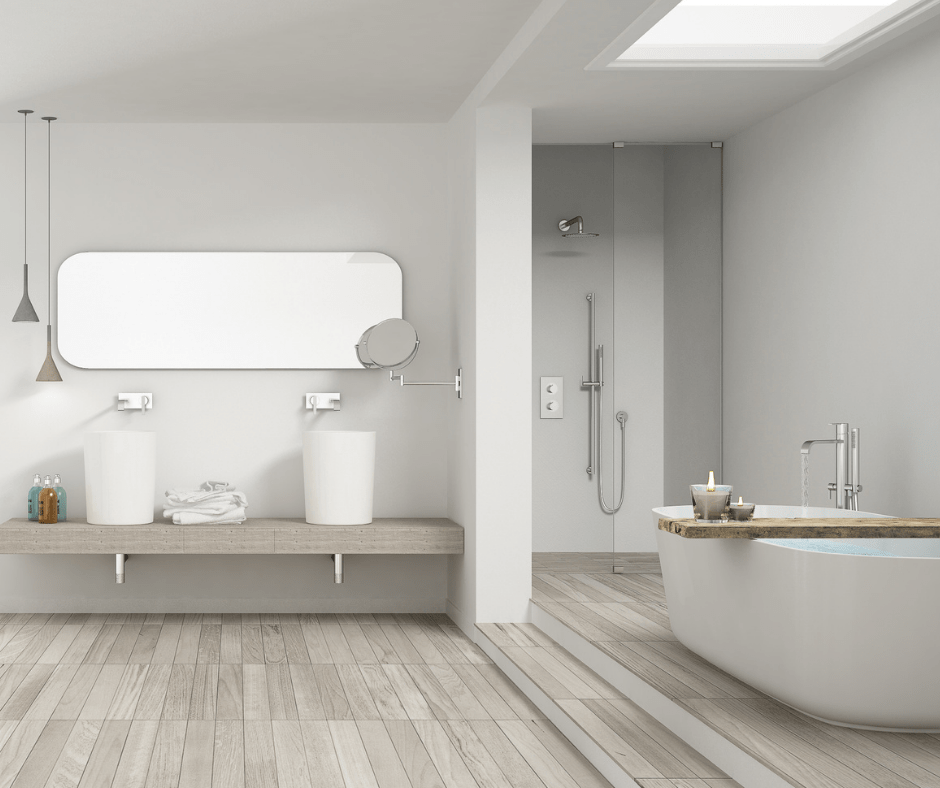 image of modern bathroom with grey wall, grey luxury vinvyl wood plank flooring, modern floating vanity with white modern stand alone bath tub and white tiled modern shower.
